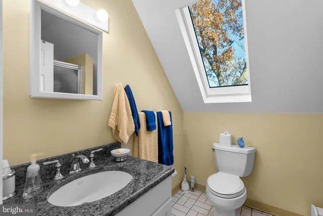 an aerial view of a houses with lake view