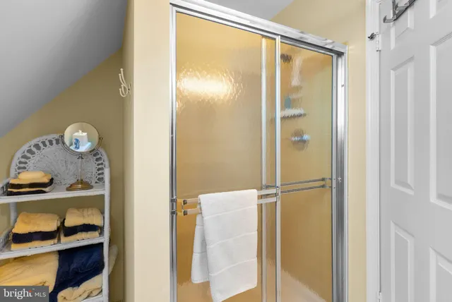 an aerial view of a house with yard and outdoor seating