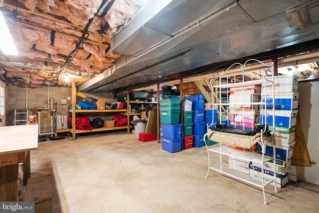 an aerial view of residential house with parking space and trees