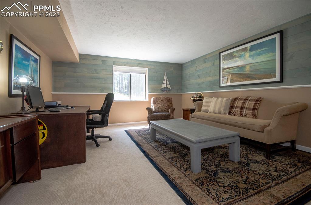 15015 Raton Road Colorado Springs, CO 80921 - Photo 32 of 45 a living room with furniture and a window