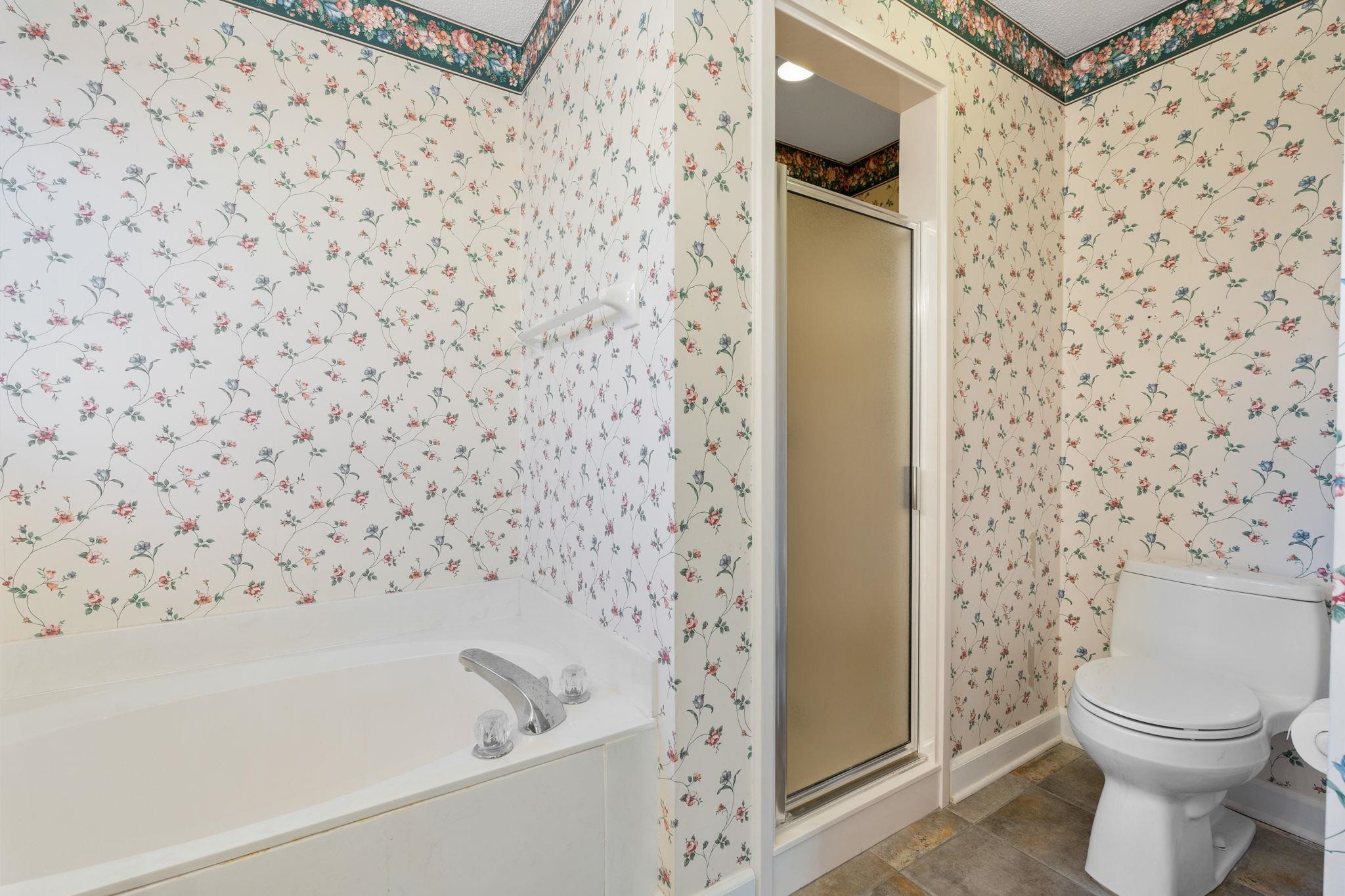 1147 Junco Cove Collierville, TN 38017 - Photo 7 of 30 a bathroom with a toilet and a shower