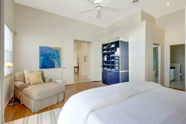 a white bath tub sitting next to a shower