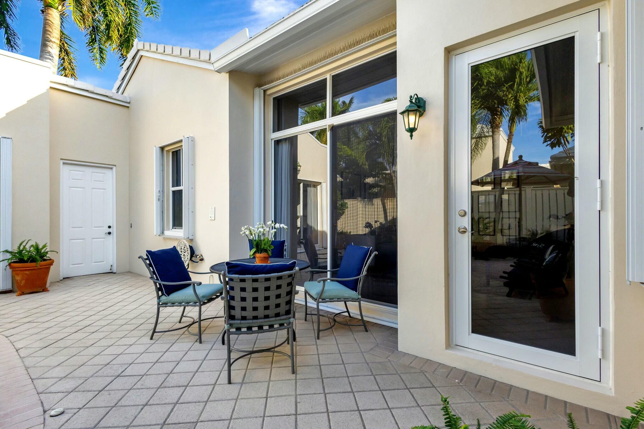 17161 Bermuda Village Drive Boca Raton, FL 33487 - Photo 35 of 54 a outdoor space with a large mirror and a rug