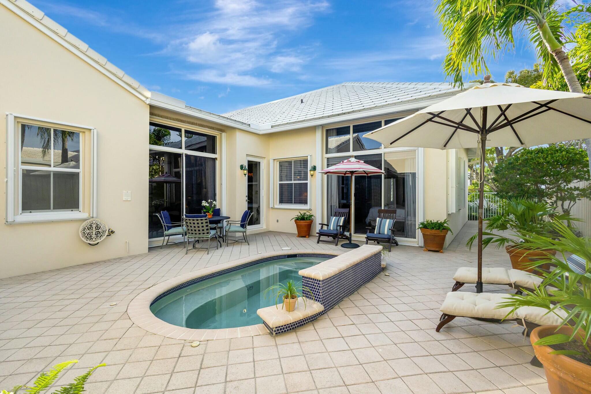 17161 Bermuda Village Drive Boca Raton, FL 33487 - Photo 37 of 54 a view of a house with backyard and sitting area