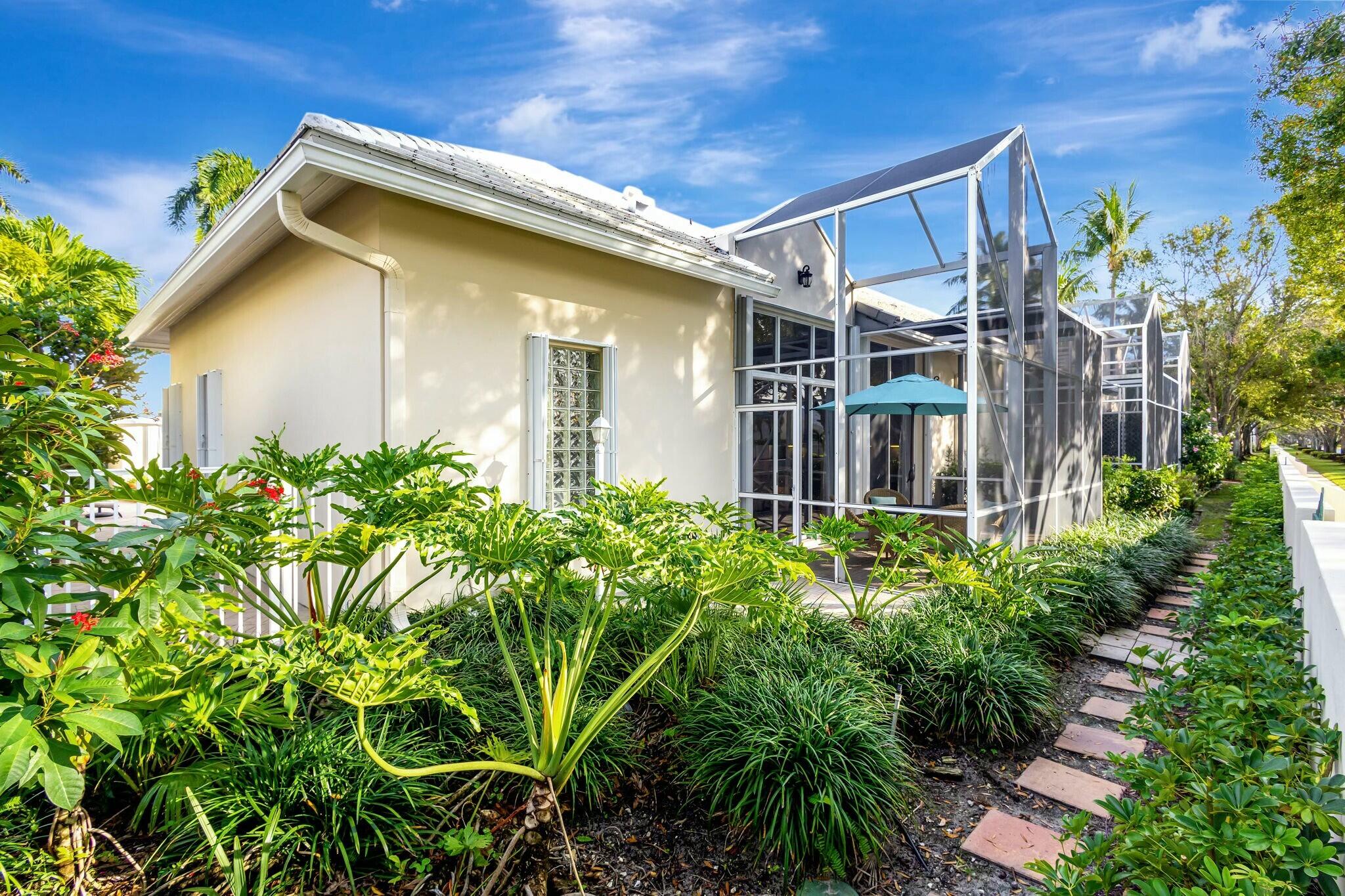 17161 Bermuda Village Drive Boca Raton, FL 33487 - Photo 47 of 54 a front view of a house with garden