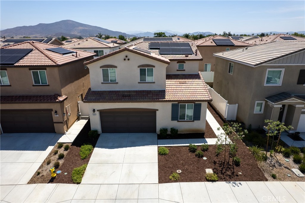 a aerial view of a house with a yard