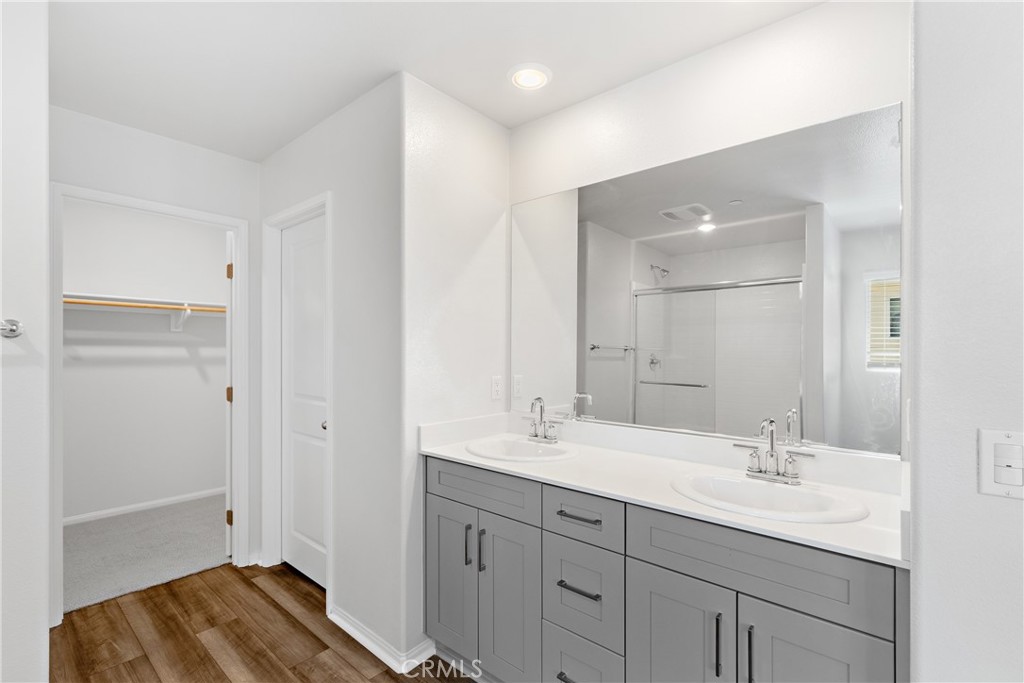 36390 West Flare Winchester, CA 92569 - Photo 11 of 46 a bathroom with a sink double vanity and a mirror