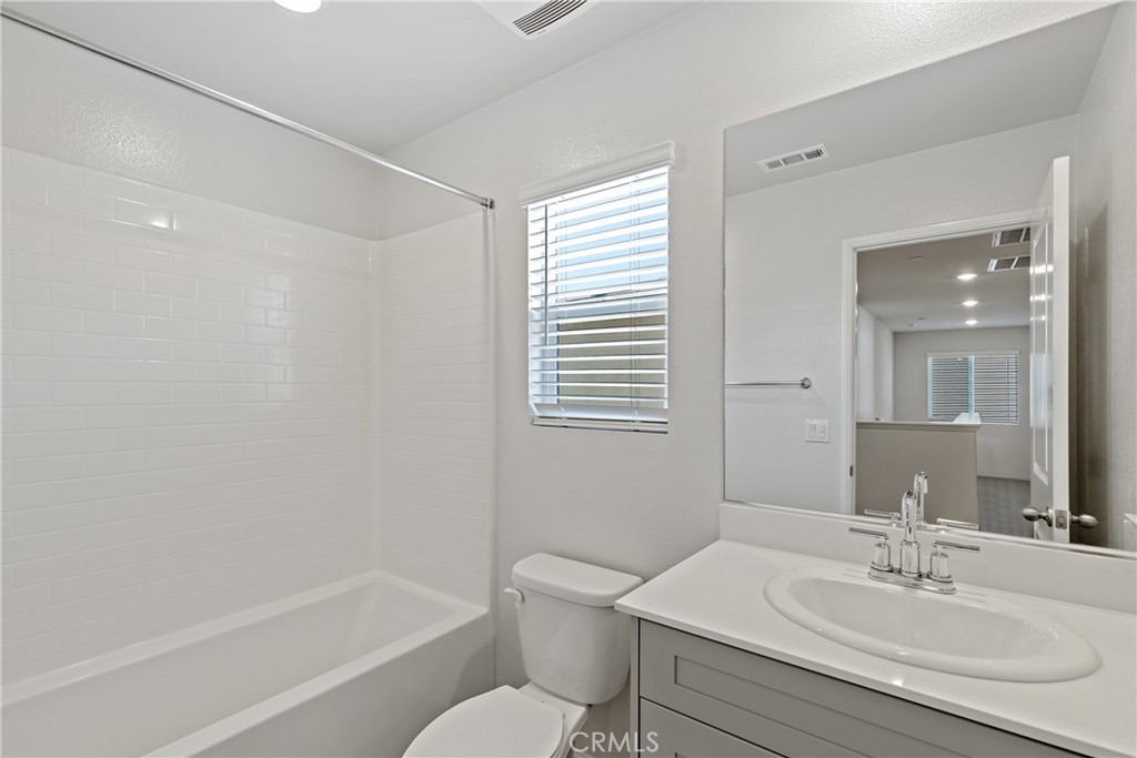 36390 West Flare Winchester, CA 92569 - Photo 16 of 46 a bathroom with a sink toilet and shower
