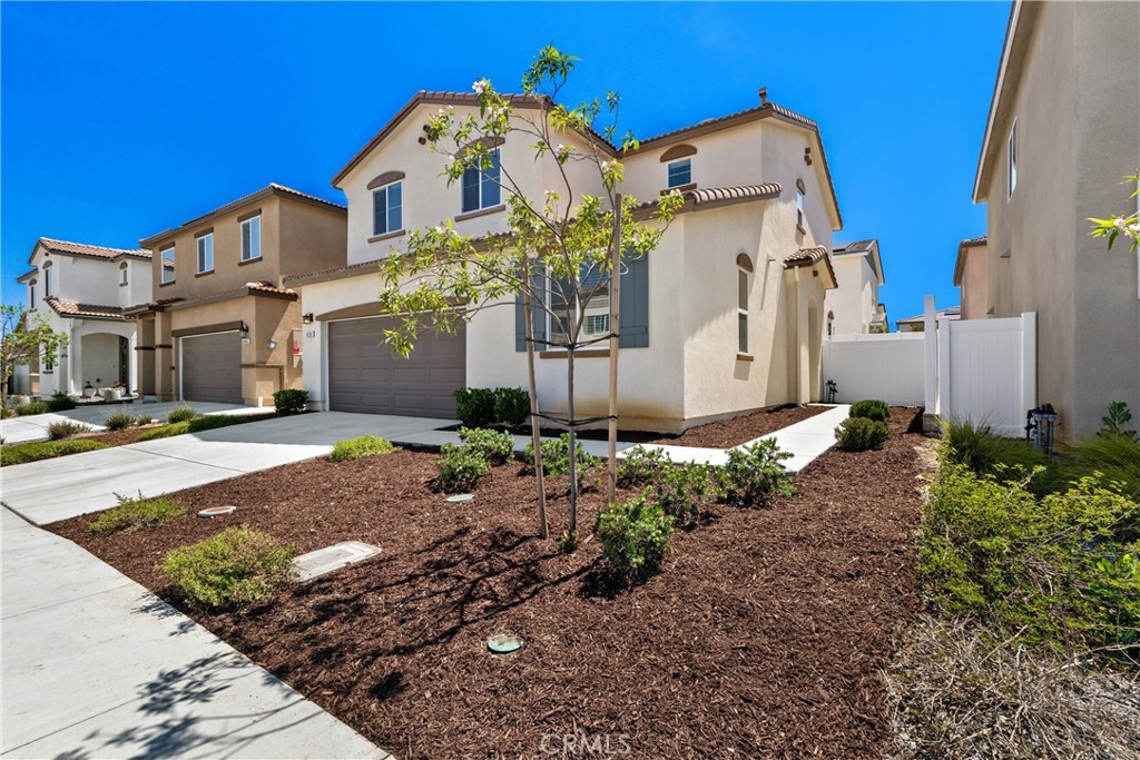 36390 West Flare Winchester, CA 92569 - Photo 3 of 46 a front view of a house with a yard