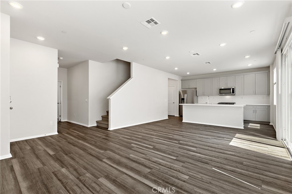 36390 West Flare Winchester, CA 92569 - Photo 33 of 46 a view of kitchen with cabinets and wooden floor