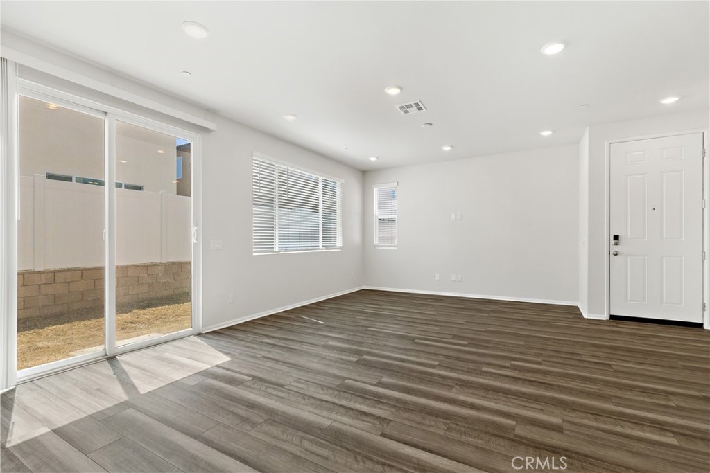 36390 West Flare Winchester, CA 92569 - Photo 34 of 46 a view of an empty room with wooden floor and a window