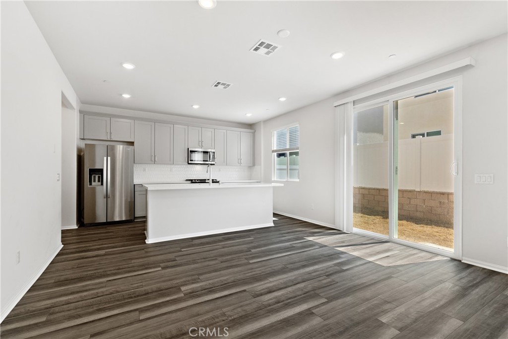 36390 West Flare Winchester, CA 92569 - Photo 35 of 46 a view of a kitchen with wooden floor