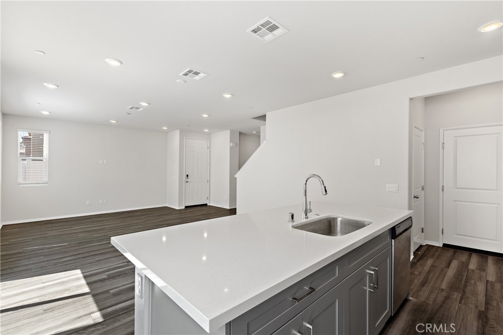 36390 West Flare Winchester, CA 92569 - Photo 38 of 46 a kitchen with stainless steel appliances granite countertop a sink a stove and a refrigerator