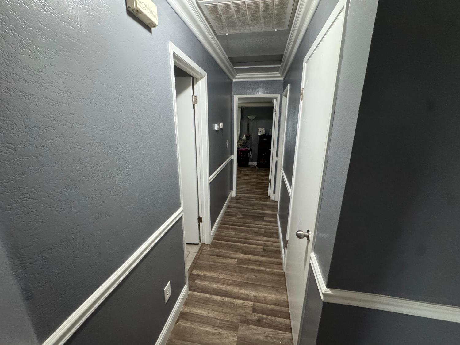 13415 South Vanderburgh Street Caruthers, CA 93609 - Photo 11 of 11 a view of entryway and hall with wooden floor