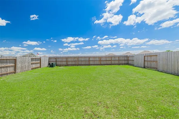a view of yard with swimming pool and outdoor seating