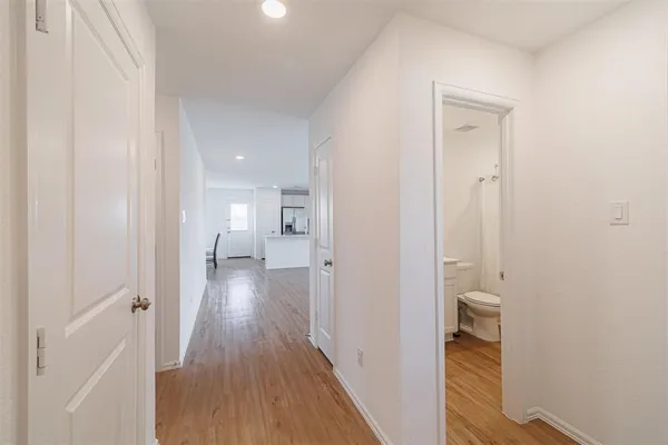 a view of a bathroom from the hallway