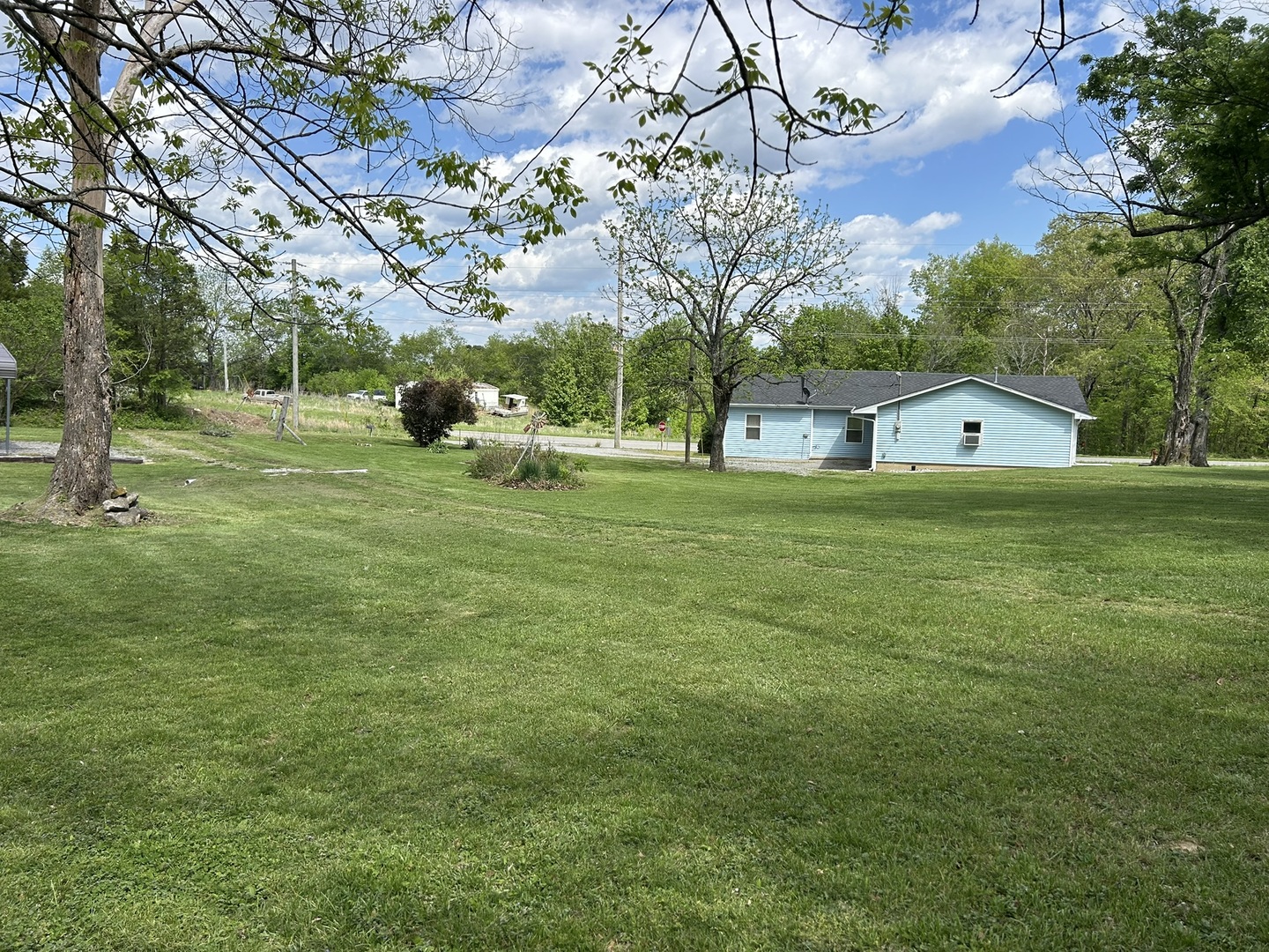 1 Bushwack Road Golconda, IL 62938 - Photo 10 of 38 a backyard of a house with lots of green space and fountain