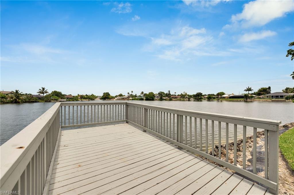 3065 50th Lane Southwest Naples, FL 34116 - Photo 26 of 31 a balcony with wooden floor and city view