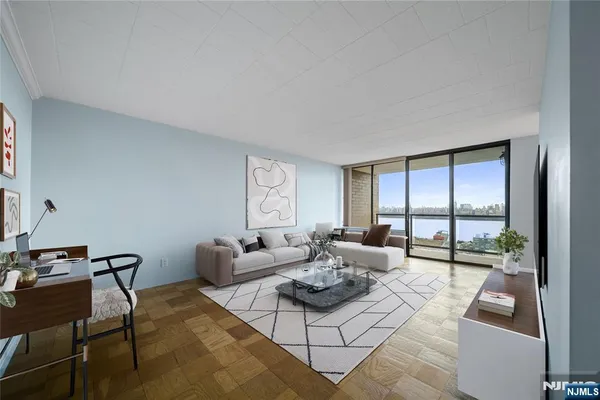 a living room with furniture and a large window