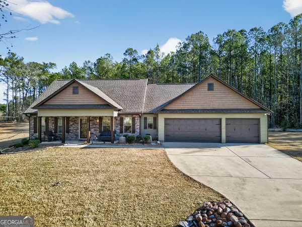 front view of a house with a yard