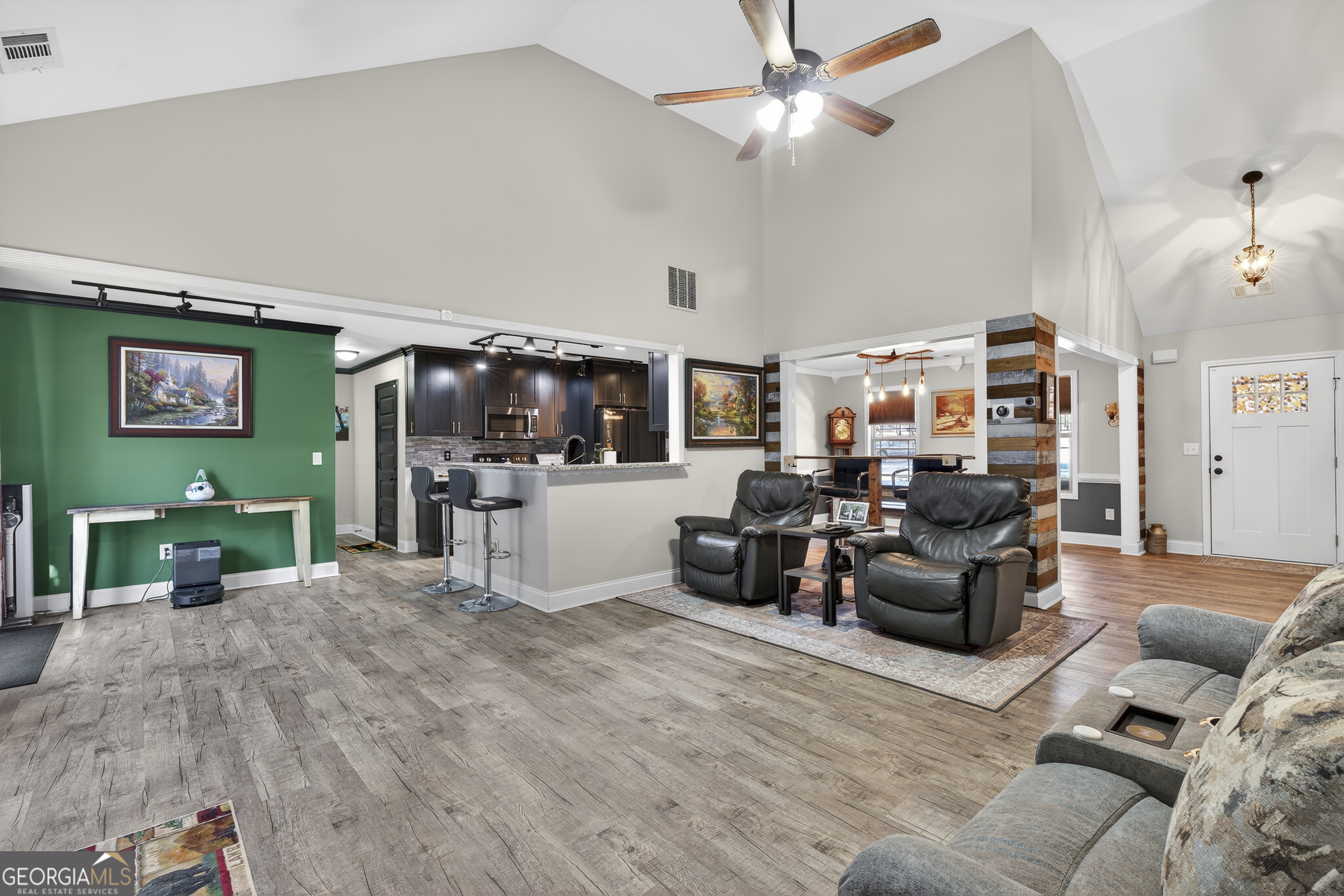 255 Needleleaf Drive Barnesville, GA 30204 - Photo 13 of 47 a living room with furniture and a flat screen tv