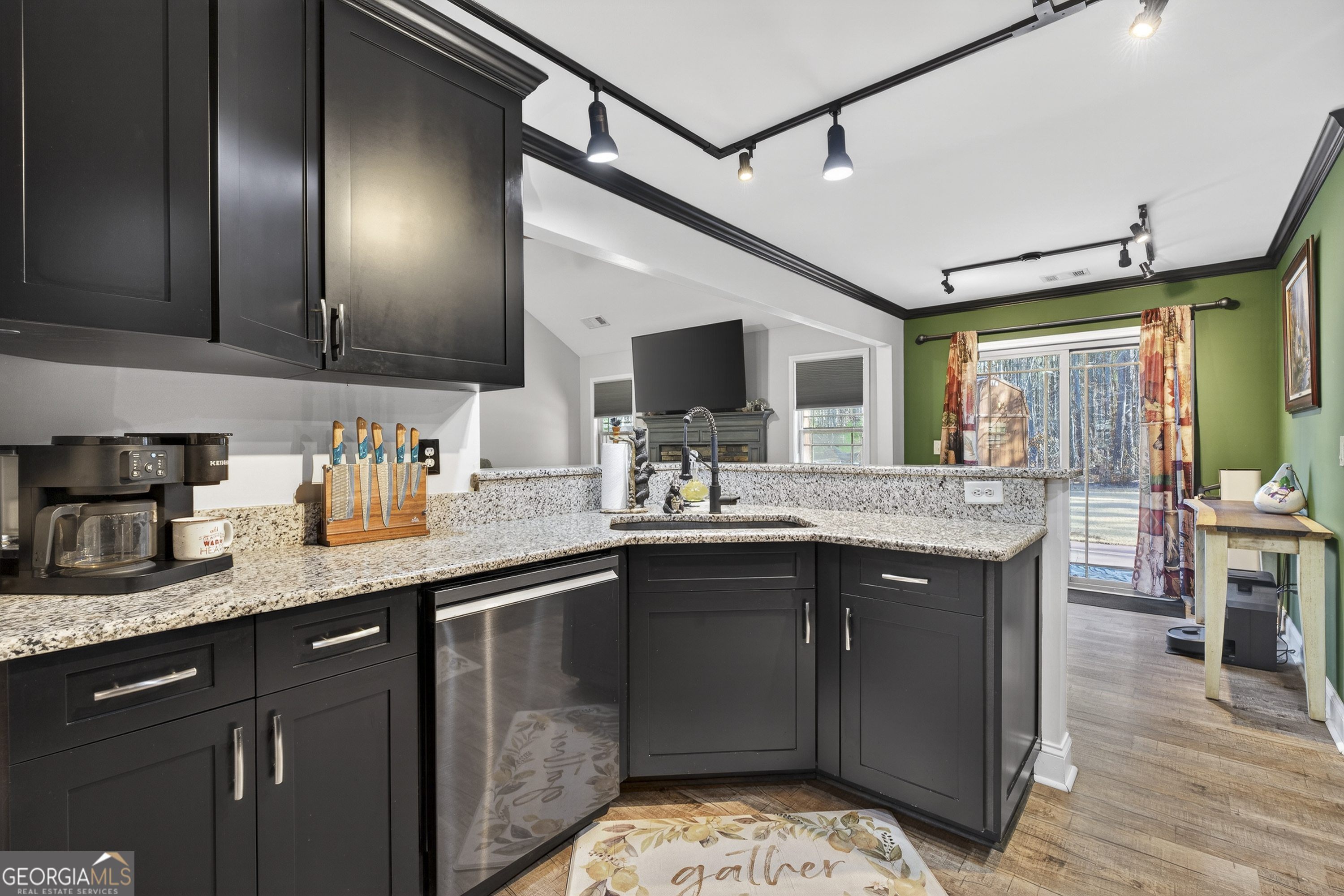 255 Needleleaf Drive Barnesville, GA 30204 - Photo 17 of 47 a kitchen with stainless steel appliances granite countertop a sink stove and cabinets