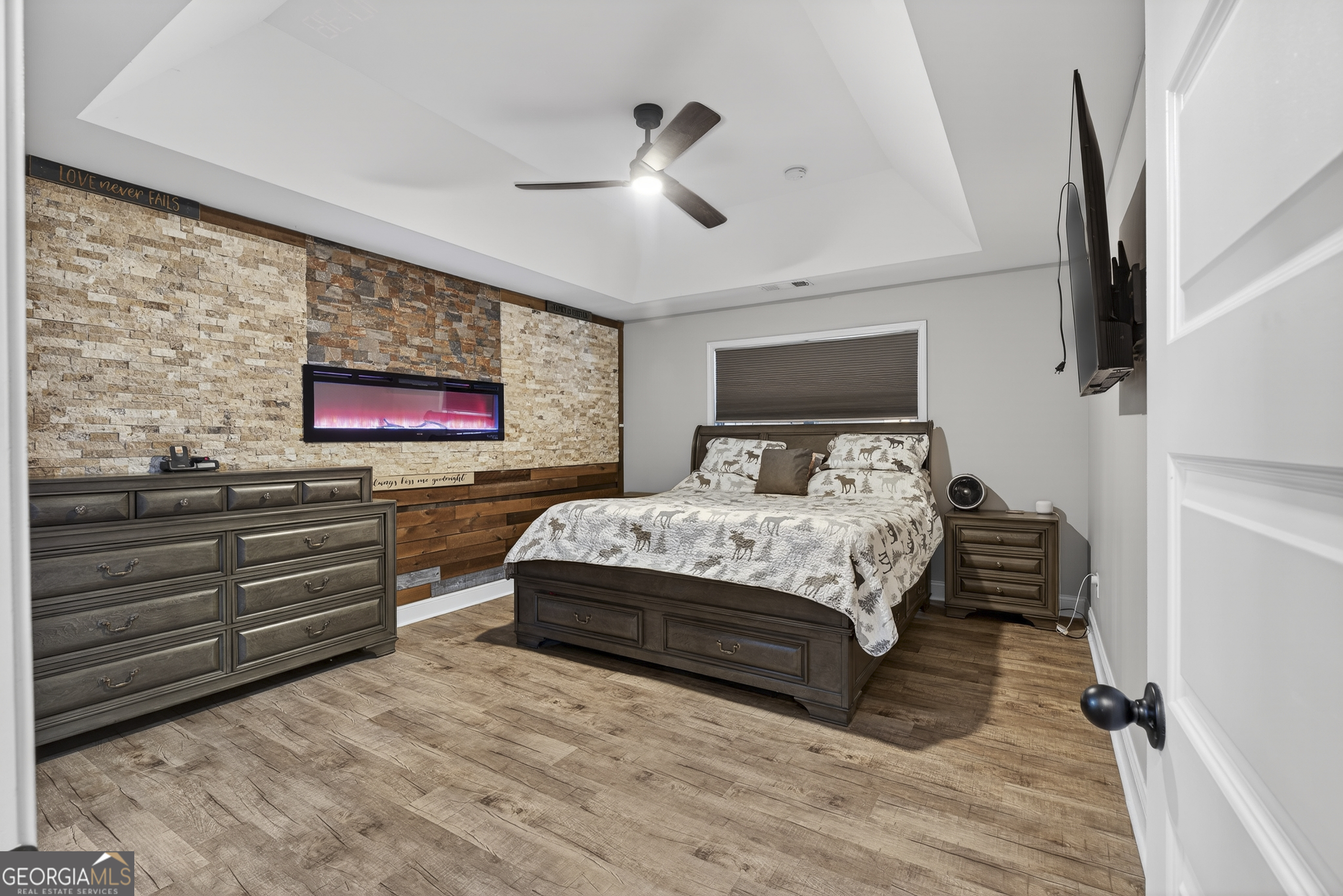 255 Needleleaf Drive Barnesville, GA 30204 - Photo 24 of 47 a bedroom with a bed and a flat screen tv