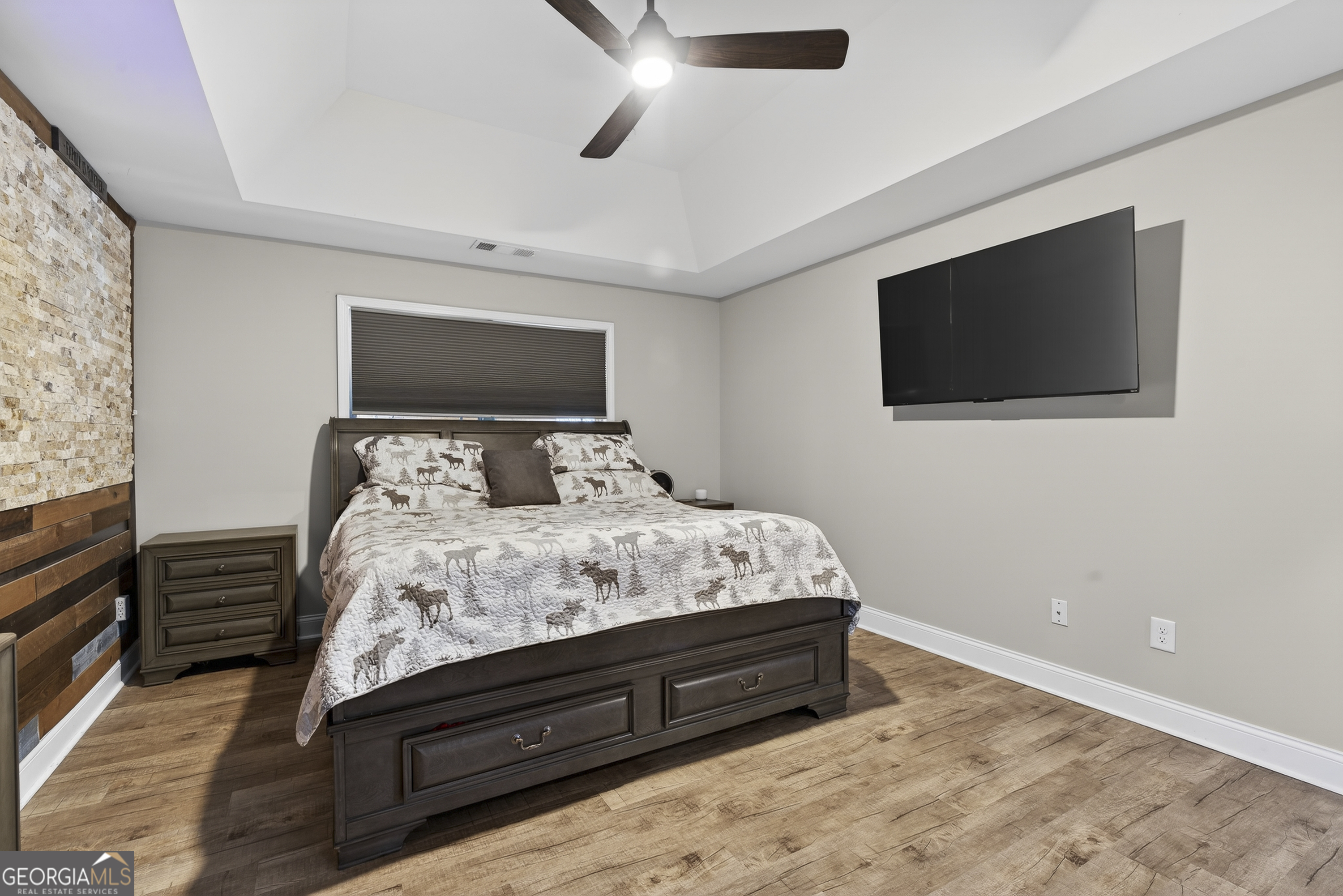 255 Needleleaf Drive Barnesville, GA 30204 - Photo 25 of 47 a bedroom with a bed and a flat screen tv