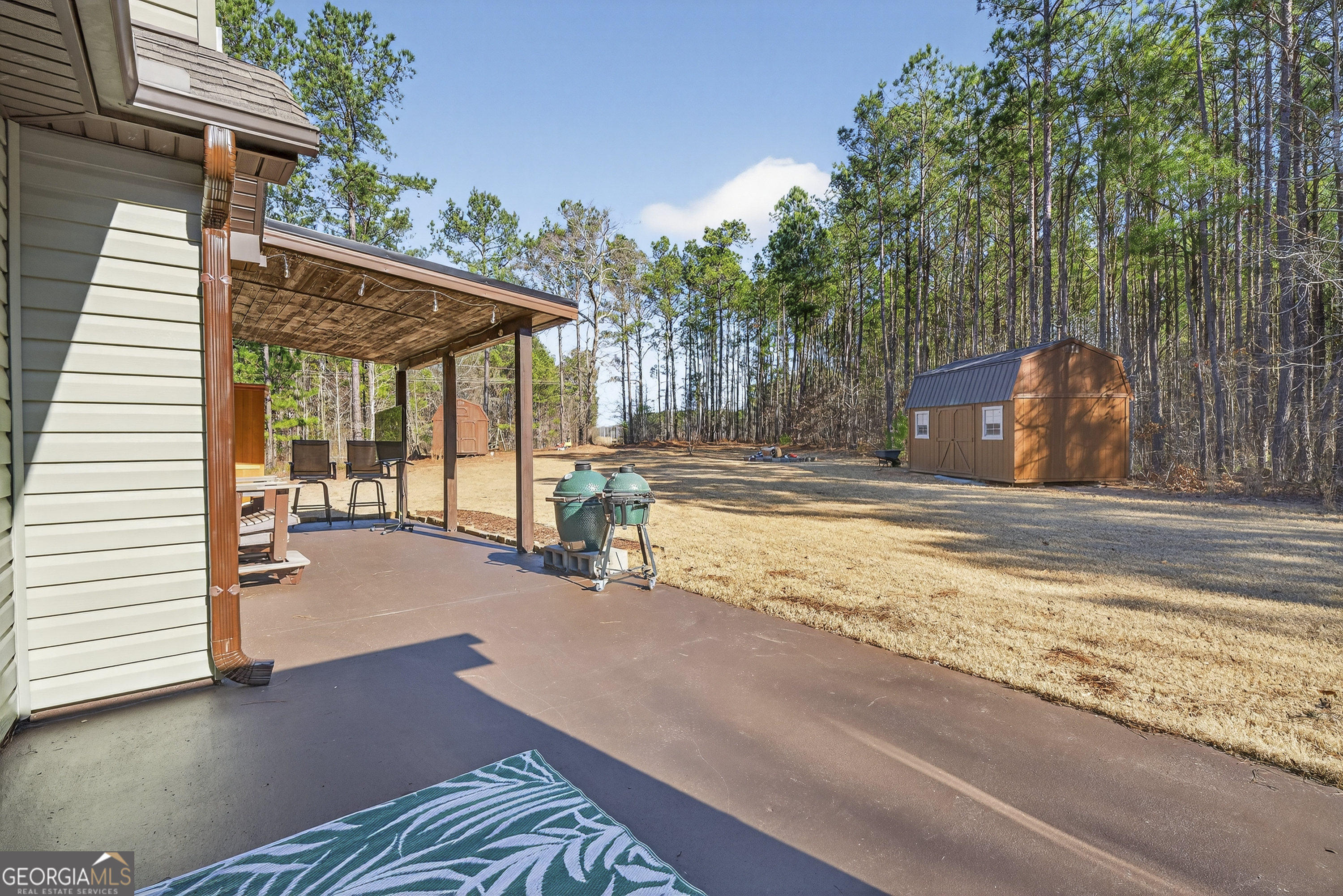 255 Needleleaf Drive Barnesville, GA 30204 - Photo 29 of 47 a view of a backyard with a patio
