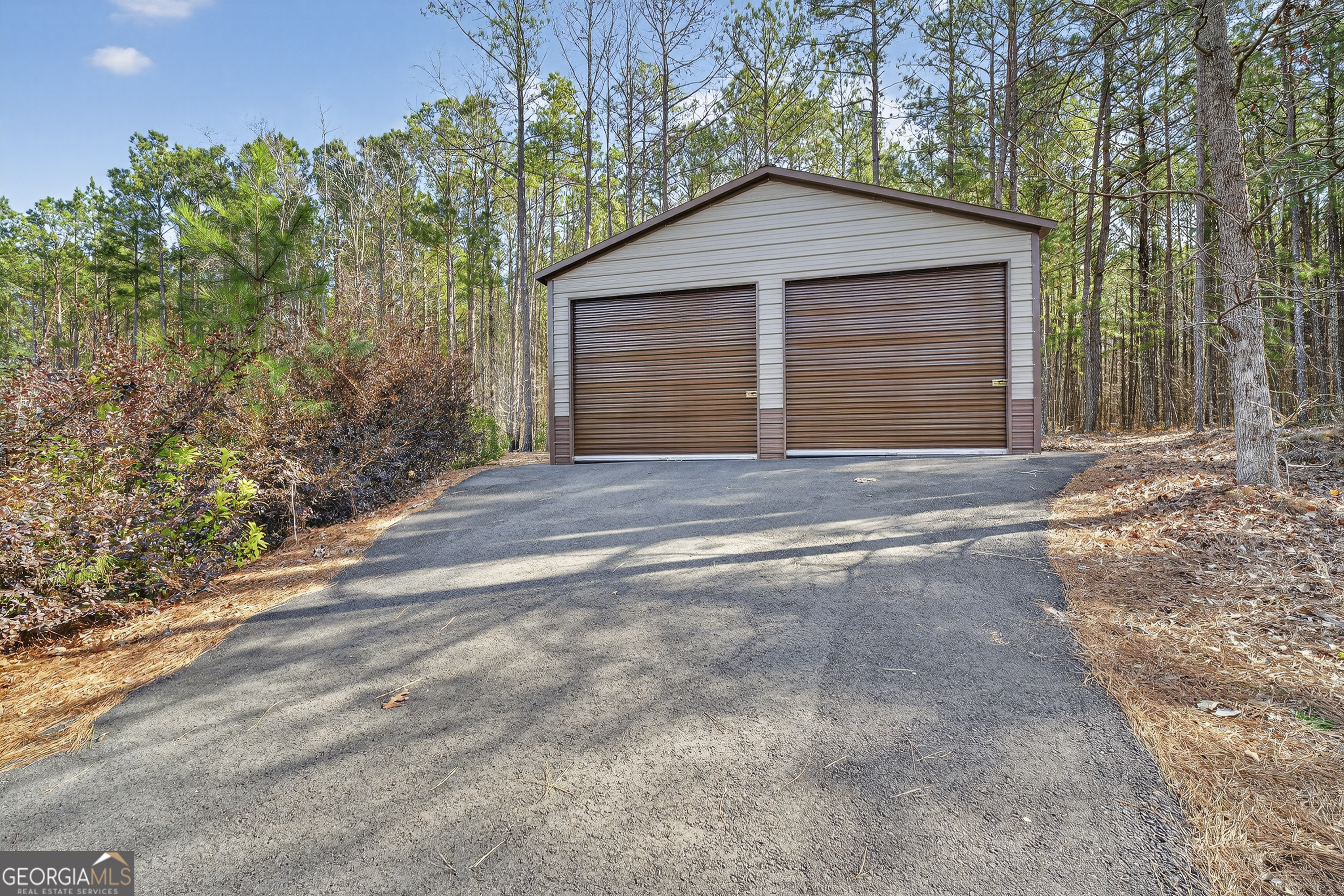 255 Needleleaf Drive Barnesville, GA 30204 - Photo 42 of 47 a front view of a house with a yard and garage