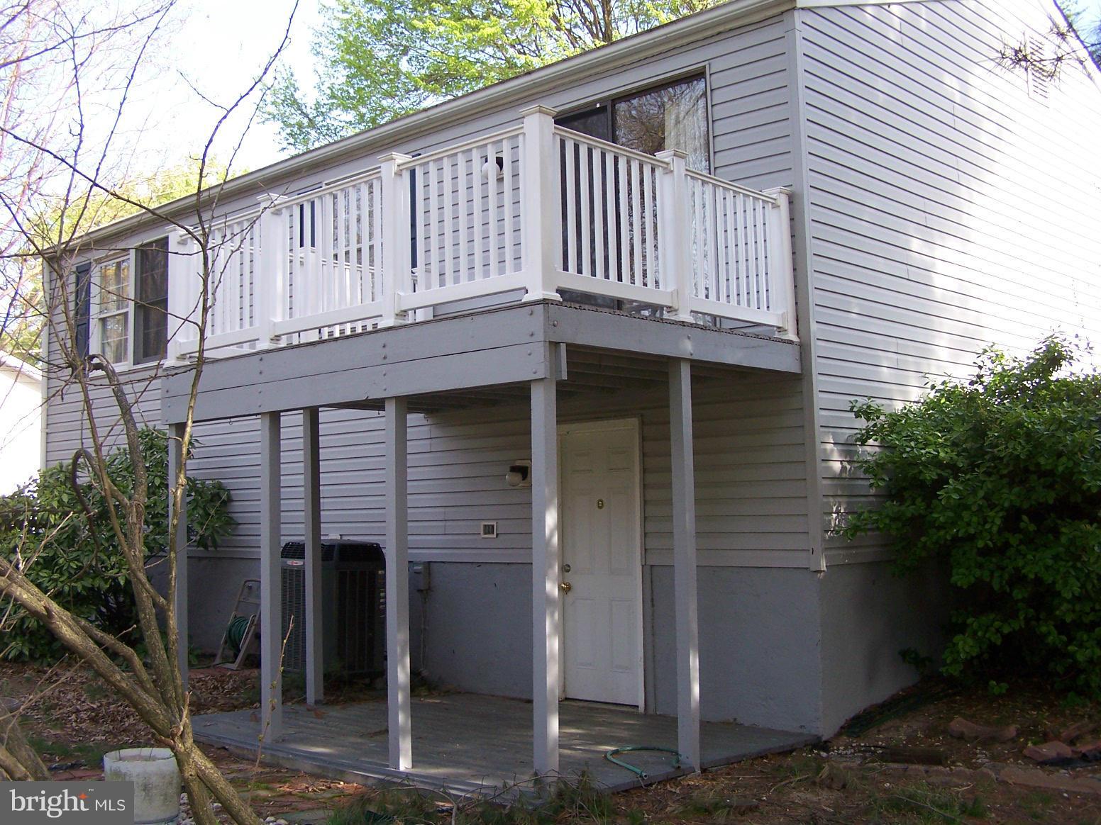 838 Evergreen Road Severn, MD 21144 - Photo 2 of 2 a white house with a outdoor space