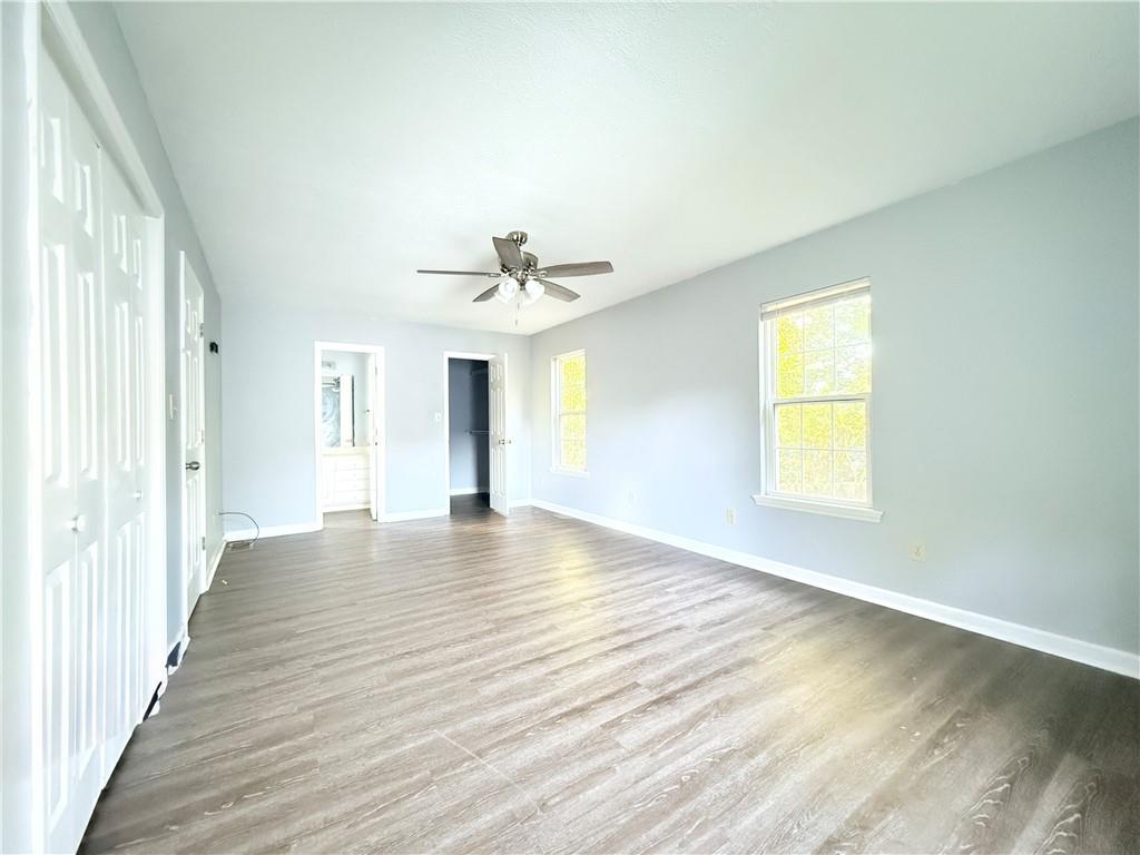 330 Peach Orchard Road Baldwin, GA 30531 - Photo 12 of 13 a view of an empty room with wooden floor and a window