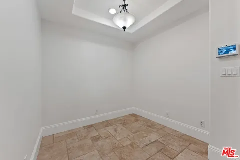 a view of a chandelier fan in a room