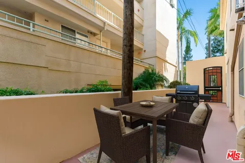 a view of balcony with large tree
