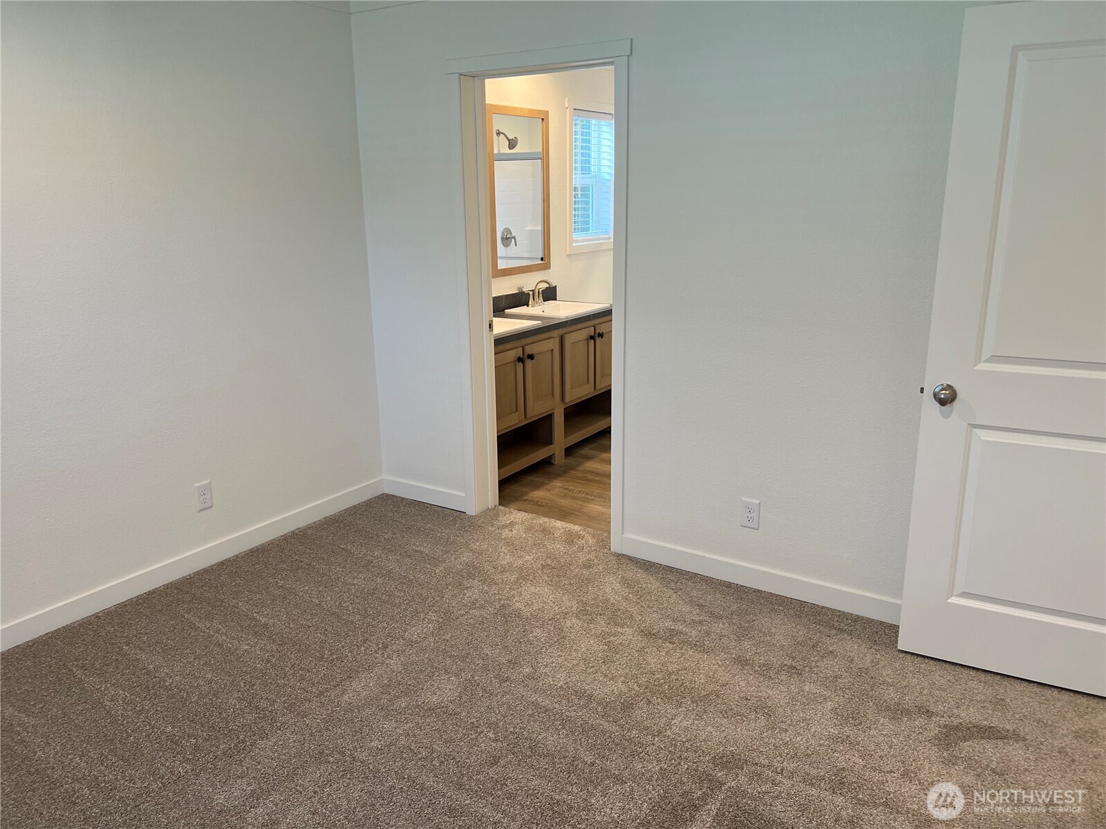512 Southwest Berry Lake Road, Unit 21 Port Orchard, WA 98367 - Photo 11 of 19 an empty room with a window