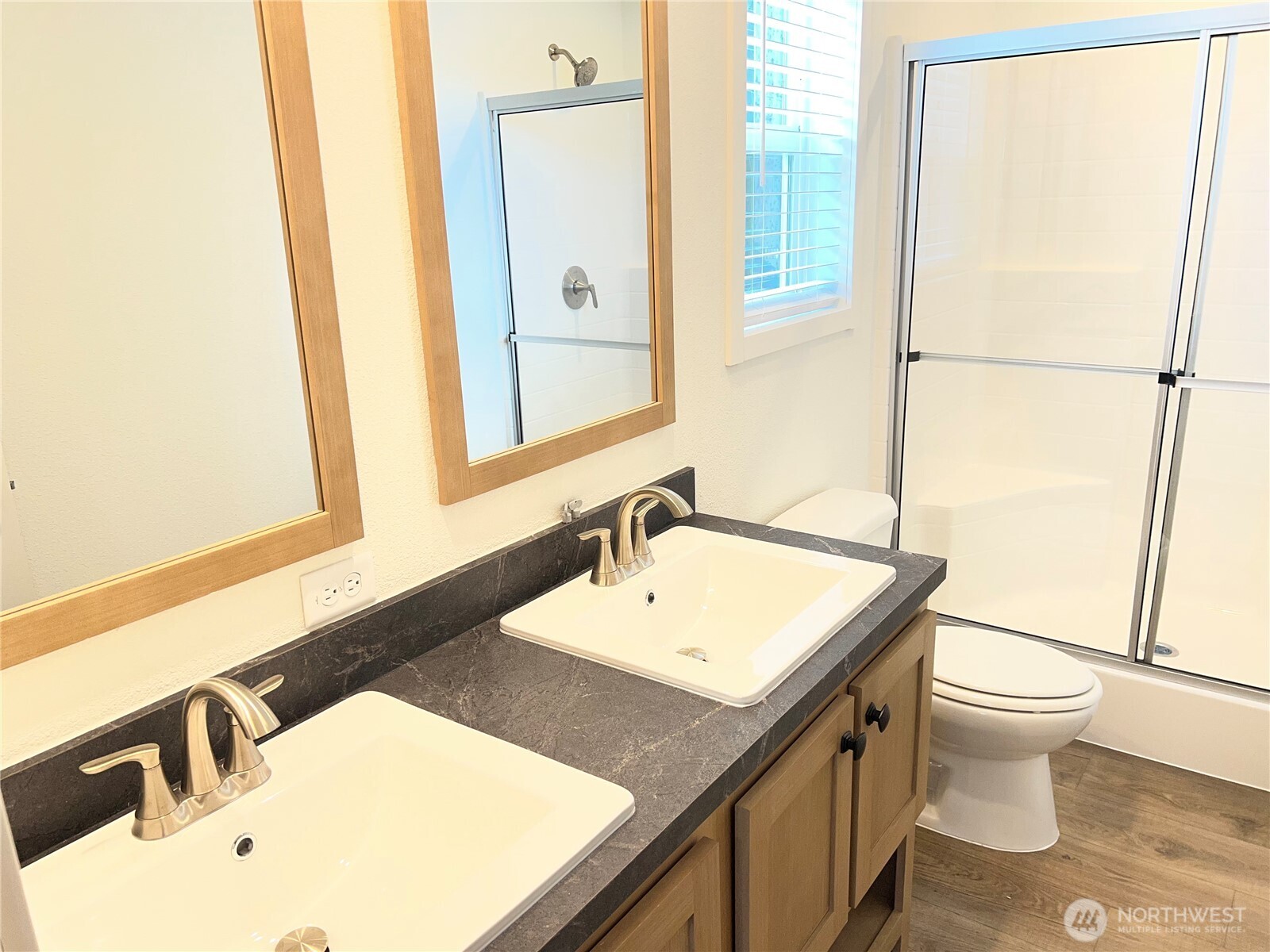 512 Southwest Berry Lake Road, Unit 21 Port Orchard, WA 98367 - Photo 12 of 19 a bathroom with a sink and a mirror