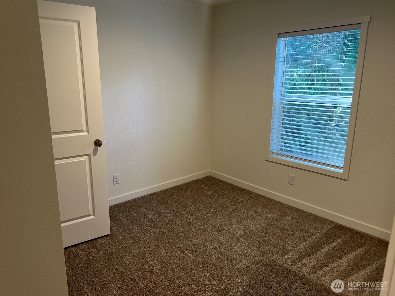 512 Southwest Berry Lake Road, Unit 21 Port Orchard, WA 98367 - Photo 15 of 19 an empty room with a window