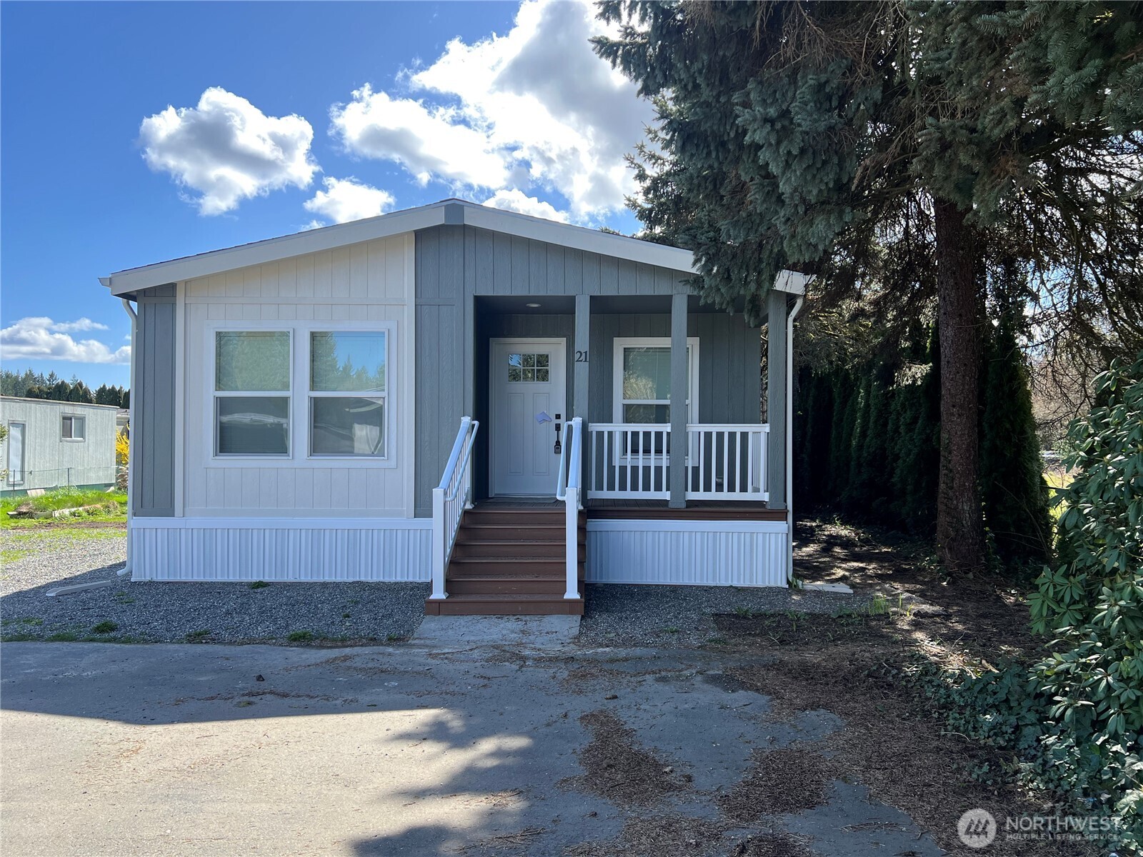 512 Southwest Berry Lake Road, Unit 21 Port Orchard, WA 98367 - Photo 19 of 19 a front view of a house with a yard