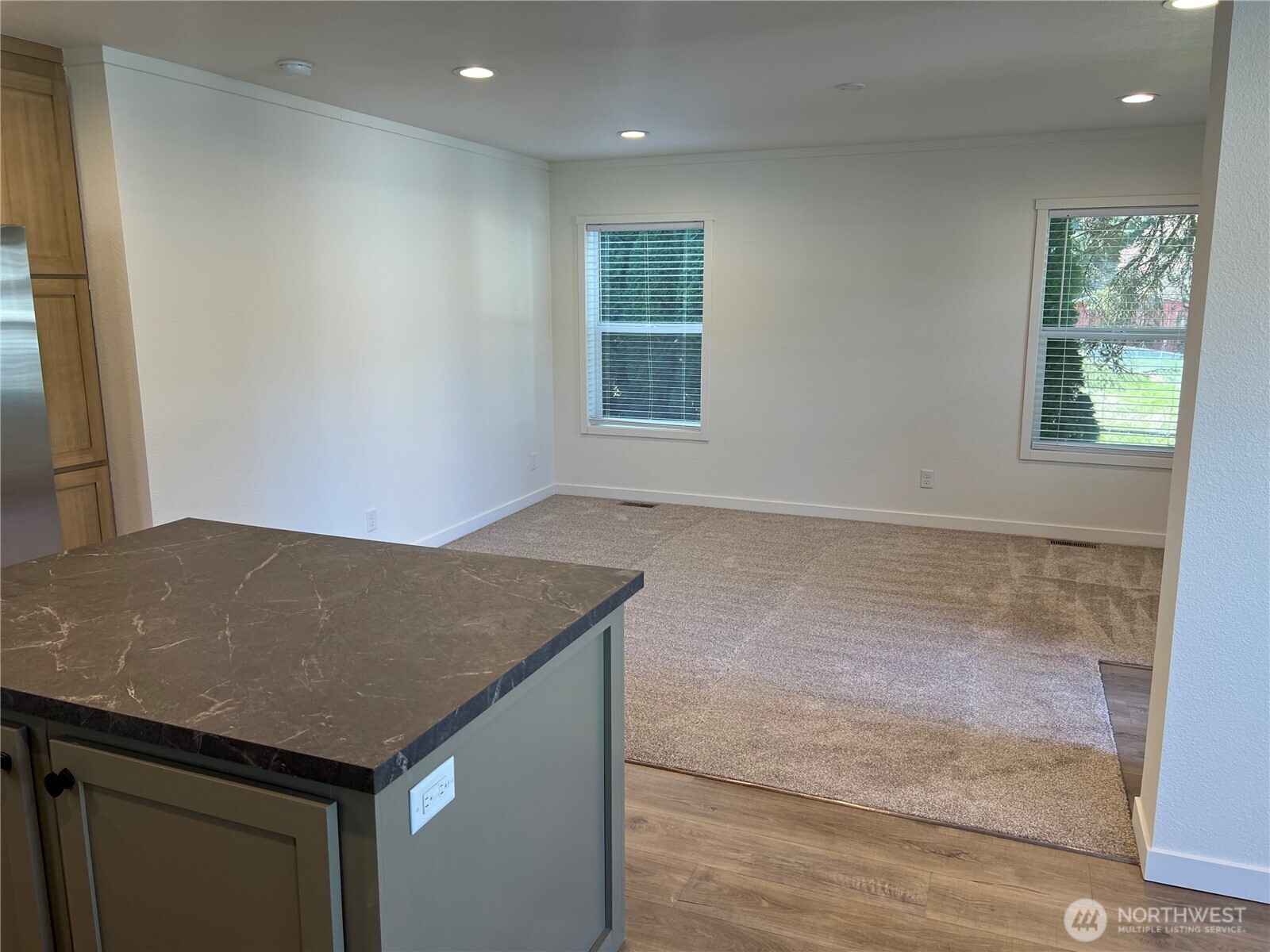 512 Southwest Berry Lake Road, Unit 21 Port Orchard, WA 98367 - Photo 9 of 19 a kitchen with a sink a counter space and a window
