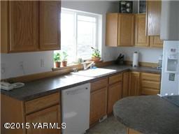 830 Hideaway Road Yakima, WA 98908 - Photo 5 of 13 a kitchen with a sink and cabinets
