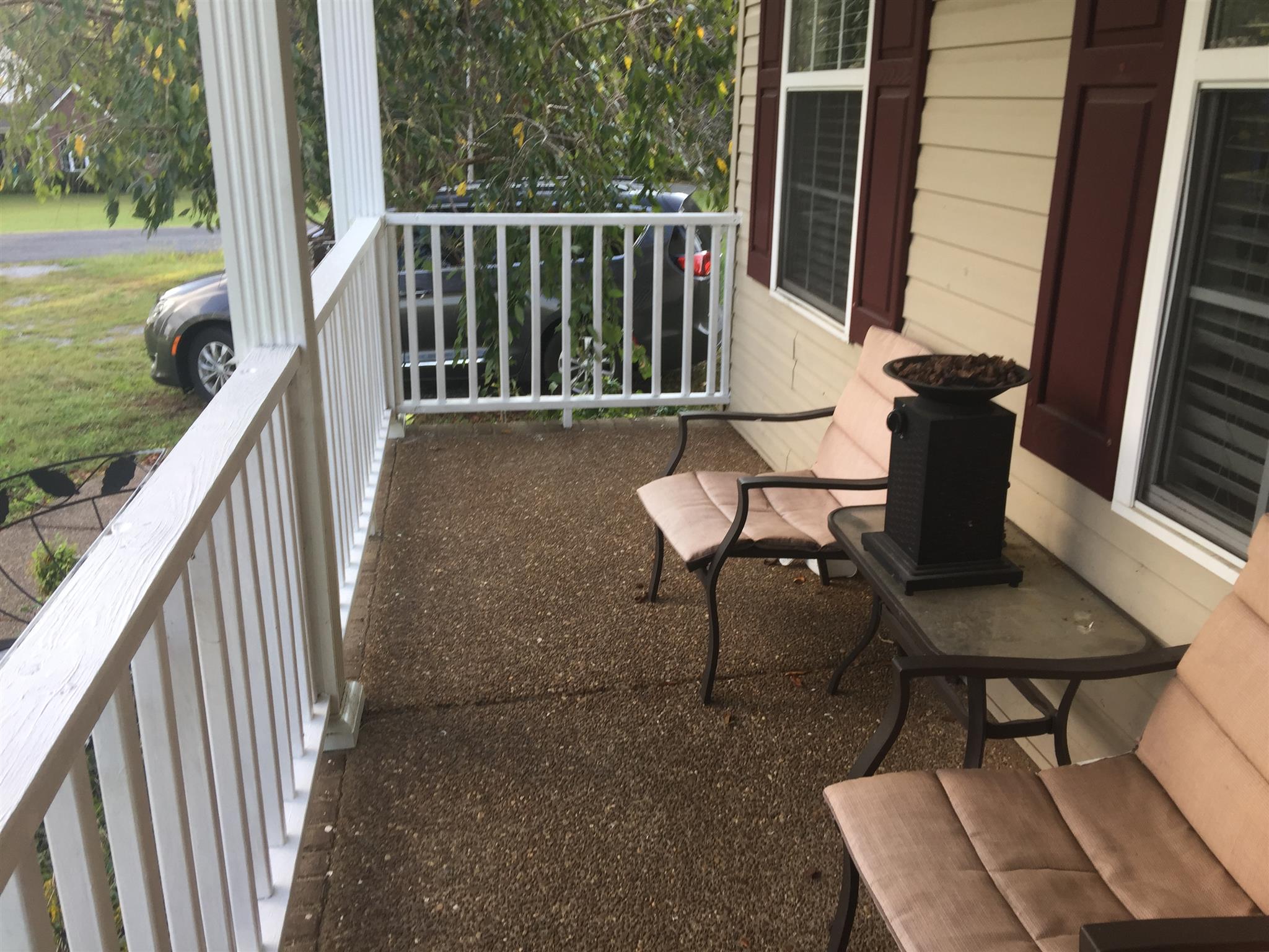 1079 Coker Ford Road Portland, TN 37148 - Photo 3 of 24 a view of balcony with wooden floor and outdoor seating