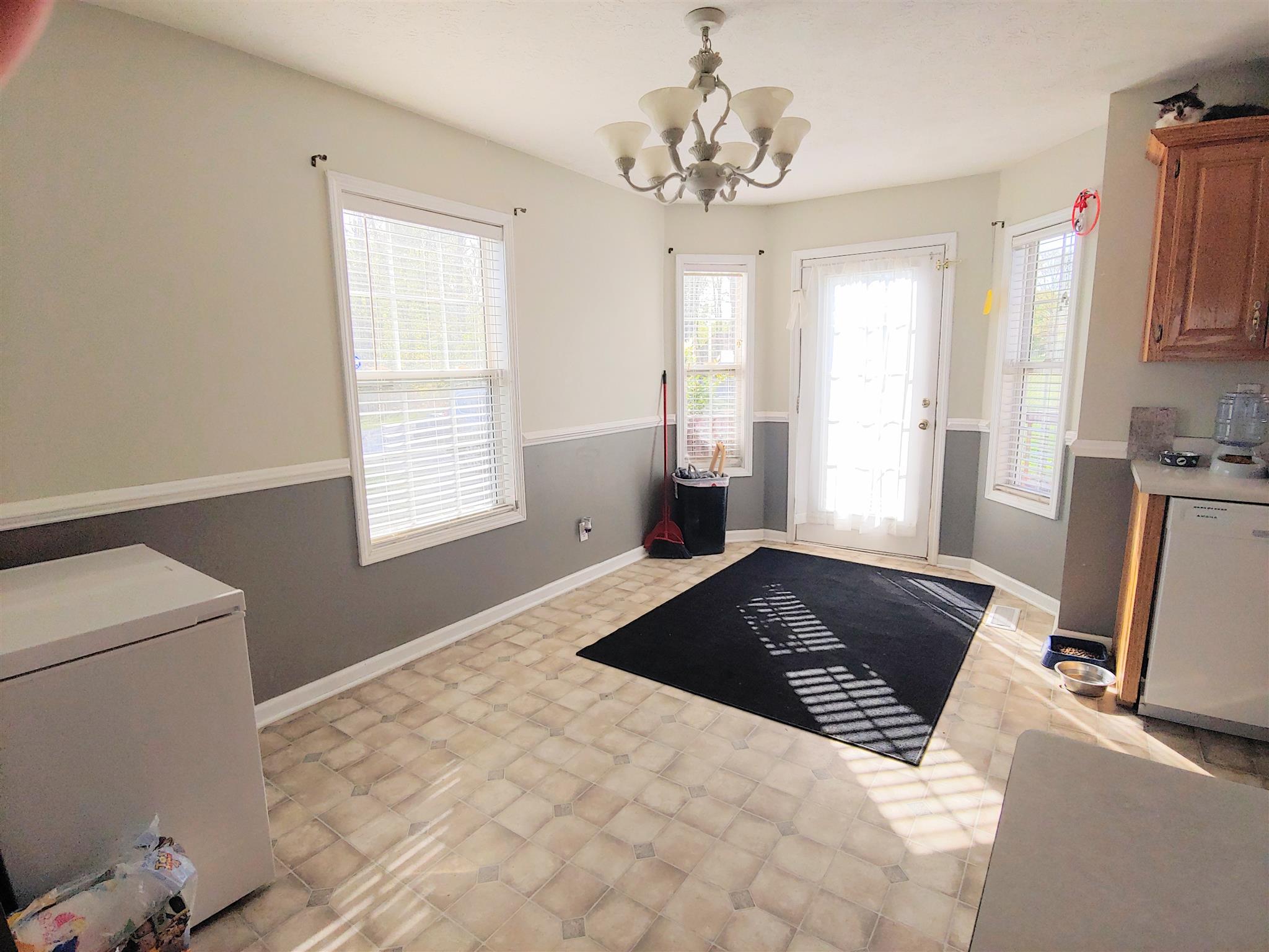 1079 Coker Ford Road Portland, TN 37148 - Photo 8 of 24 a bedroom with a bed and window