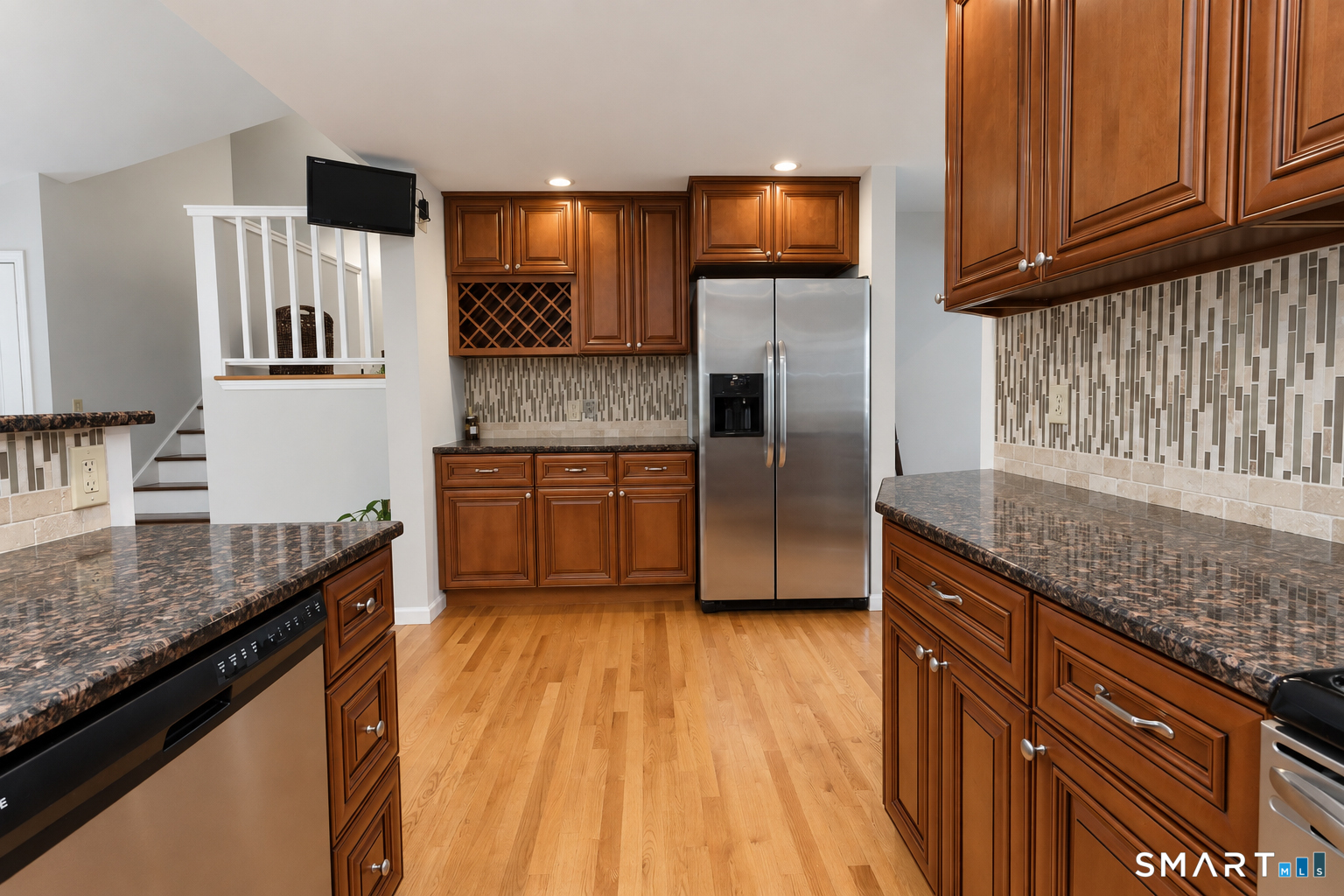 138 Tariffville Road Simsbury, CT 06081 - Photo 12 of 37 Terrific side counter and cabinets for coffee or baking station. And just a few stairs up to family room