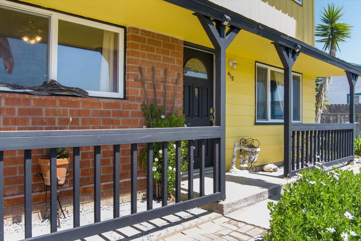 a view of a brick house with a large window