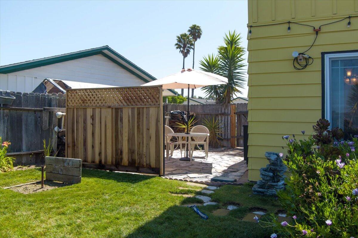 412 Milky Way Lompoc, CA 93436 - Photo 25 of 40 a backyard of a house with barbeque oven table and chairs