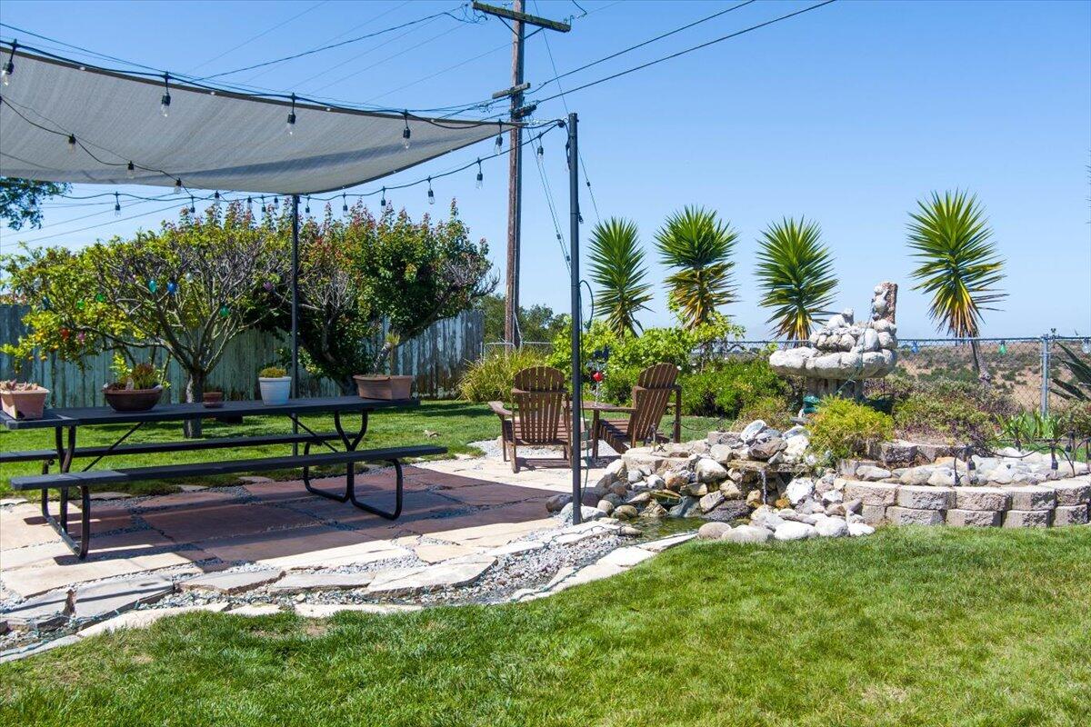 412 Milky Way Lompoc, CA 93436 - Photo 28 of 40 a view of a chair and table in backyard of a house