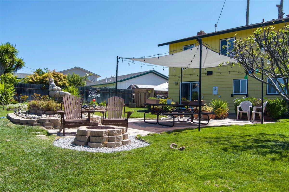 412 Milky Way Lompoc, CA 93436 - Photo 33 of 40 a view of a house with backyard porch and sitting area