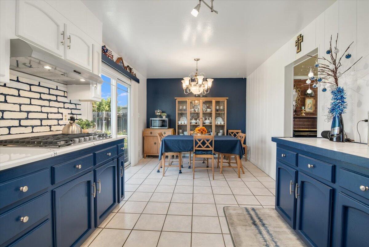 412 Milky Way Lompoc, CA 93436 - Photo 7 of 40 a large kitchen with granite countertop a sink and a stove