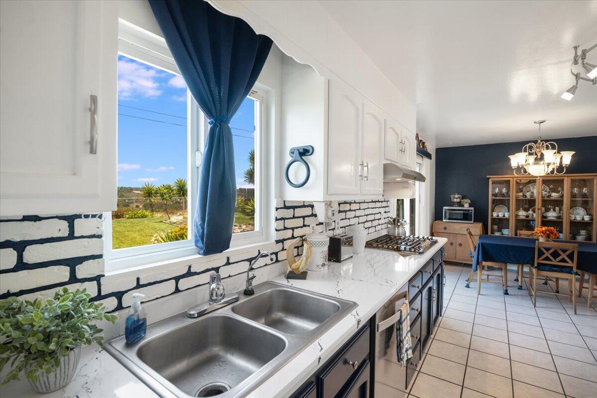 412 Milky Way Lompoc, CA 93436 - Photo 8 of 40 a kitchen with a sink and a large window