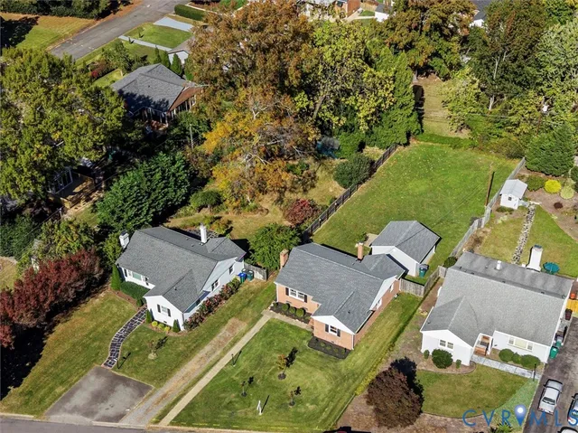 an aerial view of a house with a garden